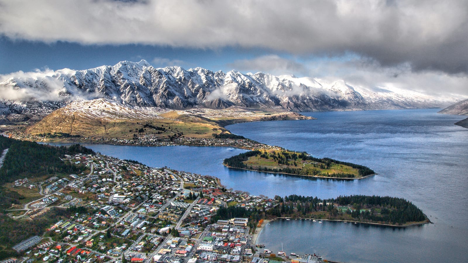 Queenstown on the shore of Lake Wakatipu with the snow-covered Remarkables behind, New Zealand