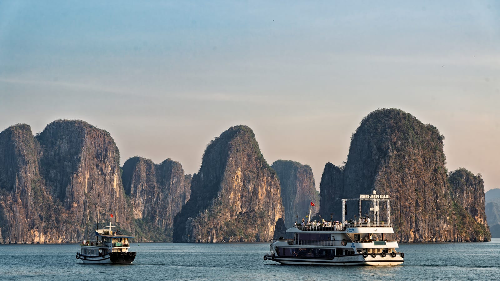 Limestone karsts and cruise boats in Ha Long Bay, Vietnam